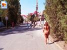 Amateur shakes her ass as she walks down the street naked