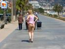 Naughty girl flashing her booty on the promenade