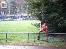 Sexy girl with ridiculous boots flashing in the park
