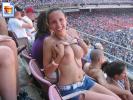 Big boobed girl shows her tits in the stands