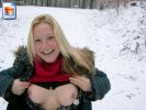 Blonde bitch tries to melt snow by pointing her titties at it
