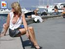 Crazy MILF lets her tit hang out at the harbor