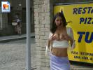 Super hot slut holding and showing her big hooters on a street corner 