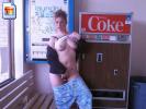 Naughty amateur whore shows her snatch and tits next to a coke machine