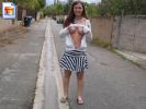 Shy teen girl shows her boobies in an alleyway