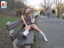 Hot young exotic chick flashes her pussy on a public park bench