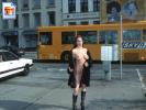 Crazy amateur girl shows off her big tits on the sidewalk
