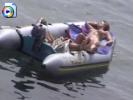 Two teen hotties nude in a rubber boat