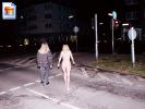 Blonde nude slut walks across town nude at nighttime