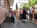 Hot girl walks on the sidewalk fully naked