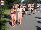 Two chubby naked teens cheer on marathon runners on a dare