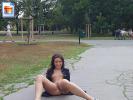 Hot brunette gets naked in the middle of a crowded parc