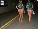 Two teen girls flash their asses on a street at night
