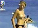 Check out this topless bitch on a public beach in Europe