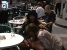 Naughty girls shove a dildo up their pussy at a crowded cafe