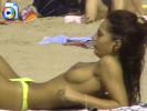 Secret video of hot girl sunbathing topless on the beach