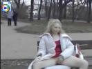 Ghost-like white chick playing with her pussy on a park bench