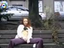 Slutty redhead chick fingers her pussy for some ducks in public