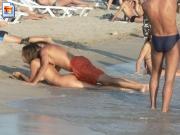 Dude tries to bang girl on public beach