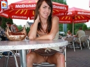 Horny brunette flashing pussy at McDonalds