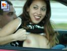 Horny amateur bitch in a car flashing tits and ass