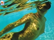 Naked girl swimming