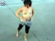Drunk girl dancing topless in the streets