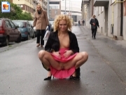 Blonde swinger shows pussy in depressing city