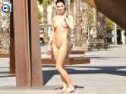 Big boobed brunette walks around nude in public