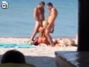 Horny slut sucks 2 dicks on public beach in spain
