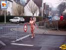 Naughty chick posing fully nude next to her favorite traffic sign