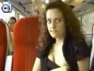 Kinky girl with curly hair flashes her tits in a train