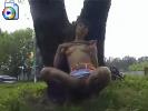 Crazy teen masturbating behind a tree, right next to the road