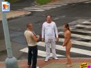 FULLY NUDE chick just standing around on a street corner, socialising.. weird.