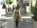 Hot girl in a long white coat flashing her tits and ass in the street