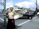 Slutty whore with a white wig flashing her titties on the streets