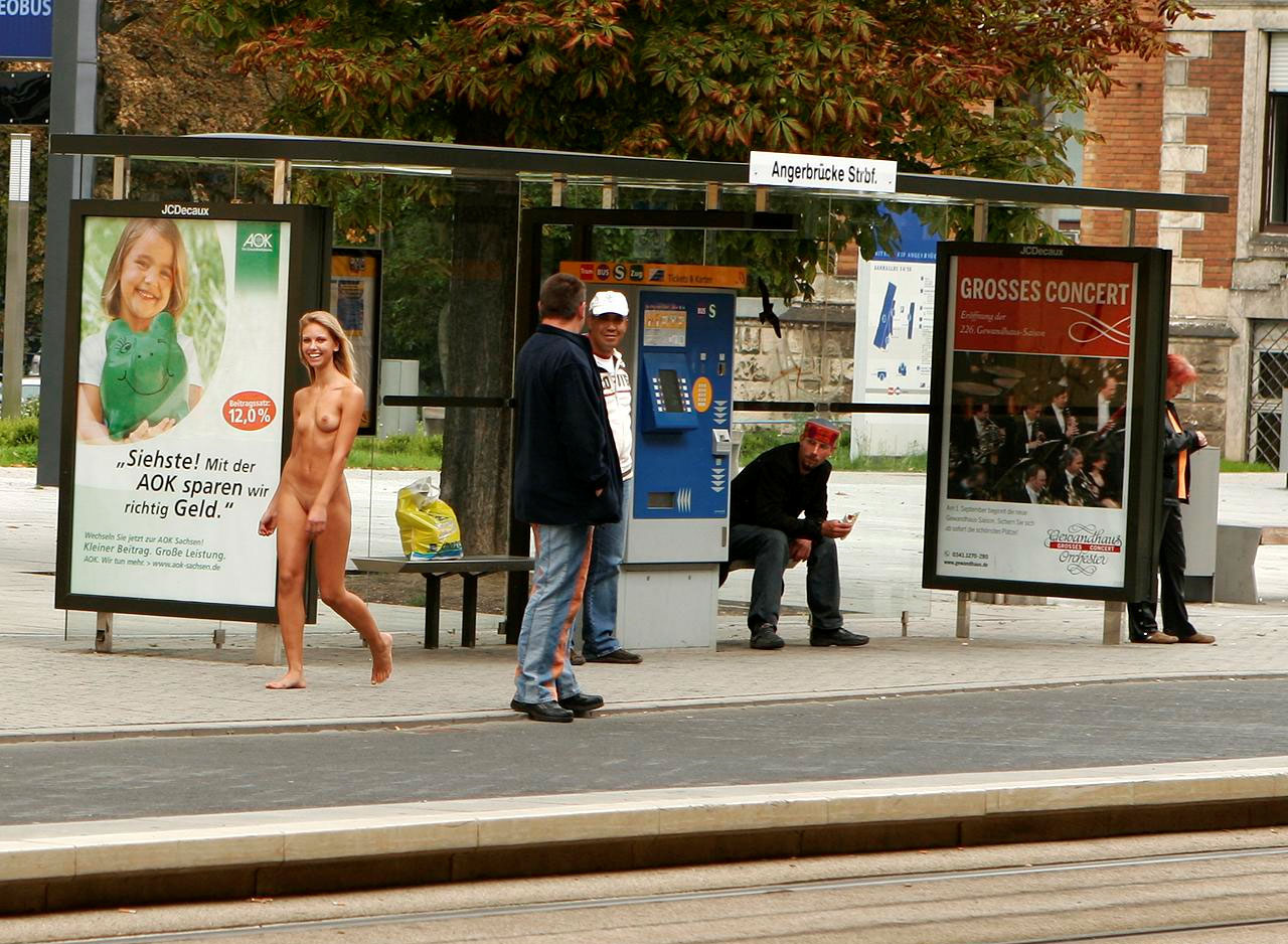 HOT skinny blonde chick walking by a bus stop with NO clothes on!