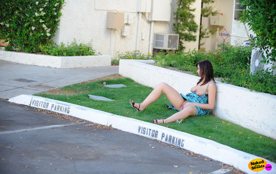 Drunk college slut sits down against a wall with her pussy exposed