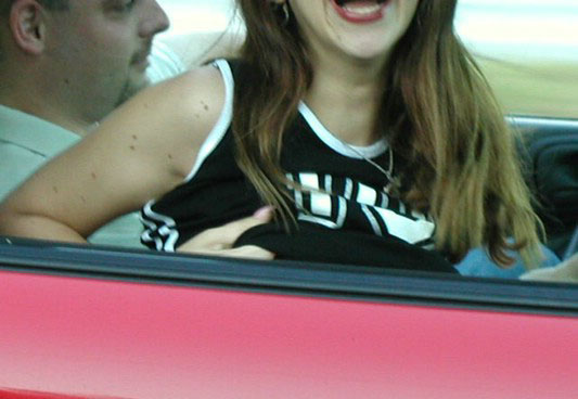 Horny amateur bitch in a car flashing tits and ass