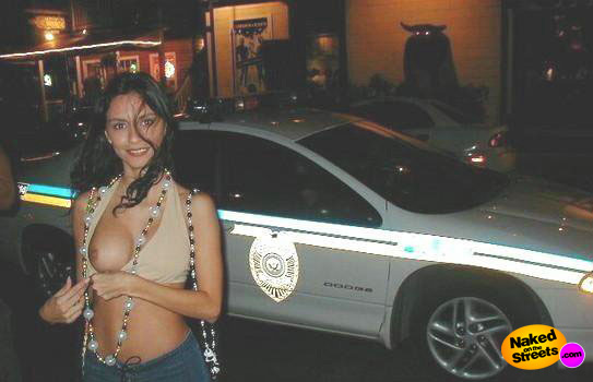 Pakistani whore shows her tits in front of cop car