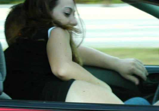 Horny amateur bitch in a car flashing tits and ass