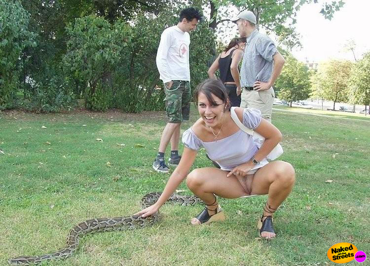 Crazy hot chick shows her snatch while petting a snake