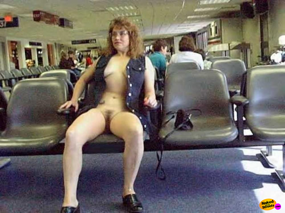 Milf slut shows her pussy at the airport