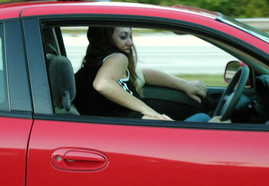 Horny amateur bitch in a car flashing tits and ass
