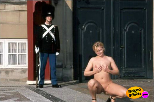 Kinky chick shows off her body in front of an English guard