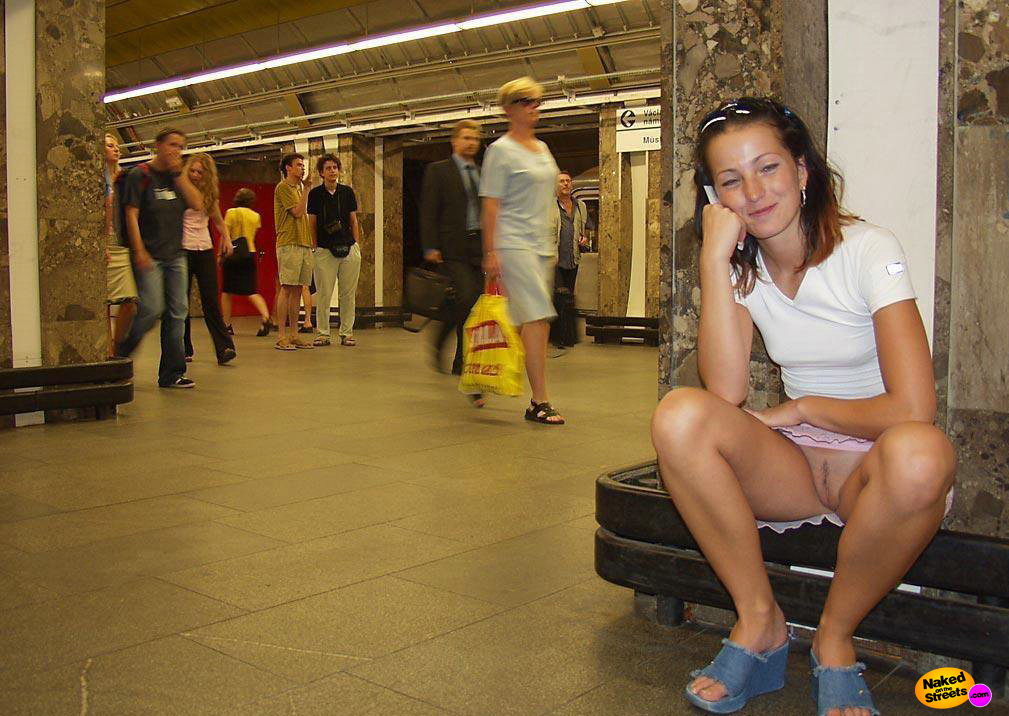 Smiling girl shows her snatch at the station