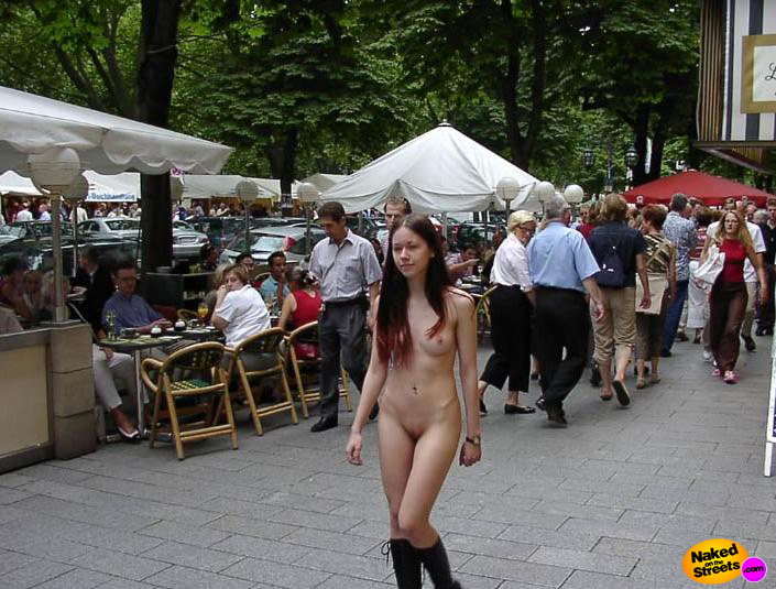 Tiny teen chick walking past a street market dressed in nothing!