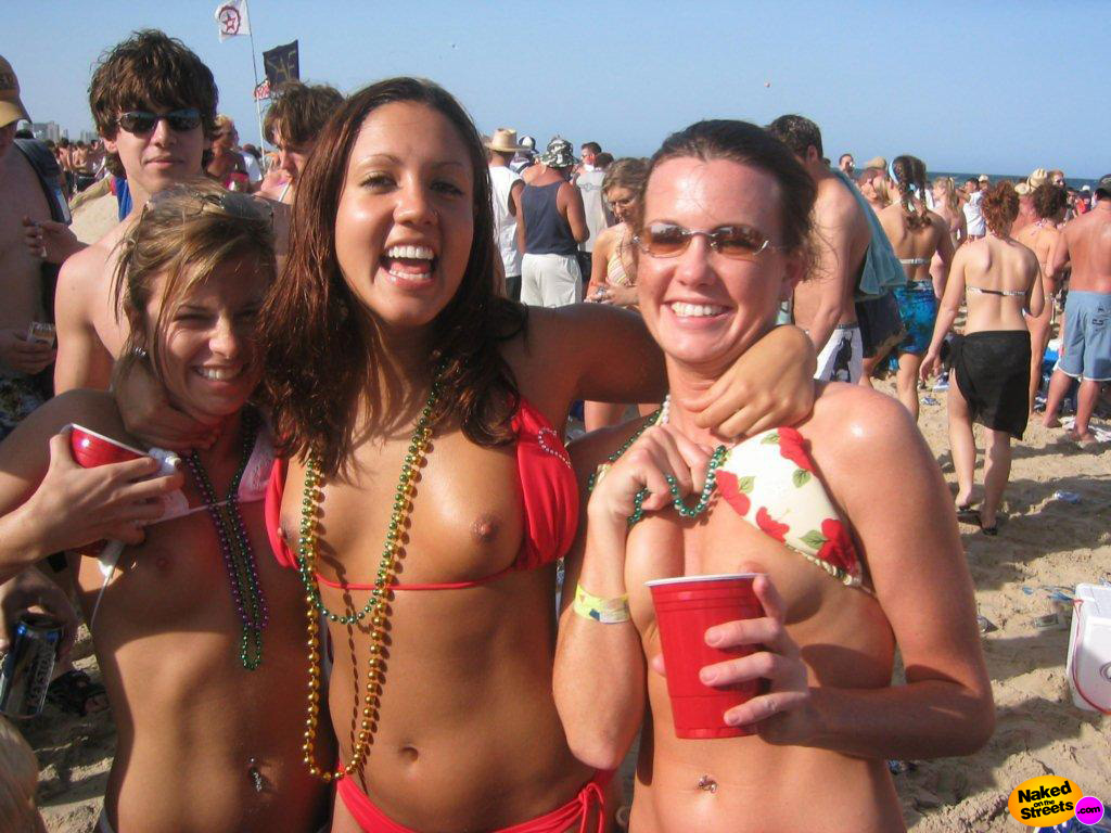 Crazy drunk college whores flashing their titties at a Spring Break celebration image