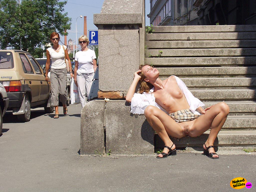 Crazy amateur slut flashing her pussy while sunbathing on the sidewalk