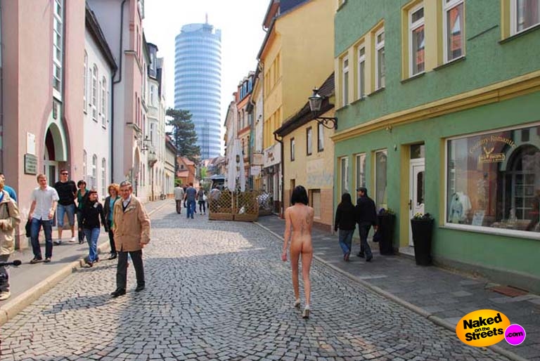 Skinny bitch walks the streets naked